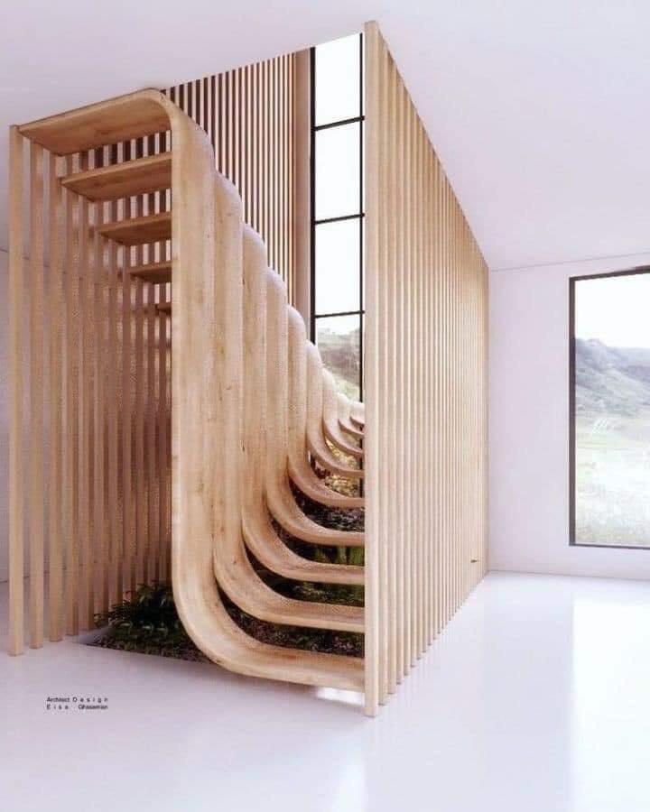 Mẫu cầu thang đẹp độc lạ 7 - Các thanh gỗ được tạo hình cong bậc thang đẹp tinh tế. Vừa là không gian giao thông chiều dọc vừa là tác phầm nghệ thuật trang trí